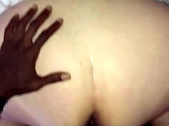 A young black man with a large penis has sex with an attractive older blonde woman