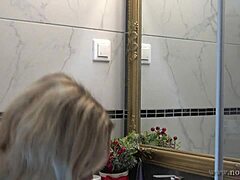 Petite wife with big tits bends over to change lingerie in the bathroom