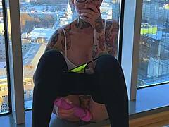 Tattooed babe fingers herself and has intense orgasm while visiting friends